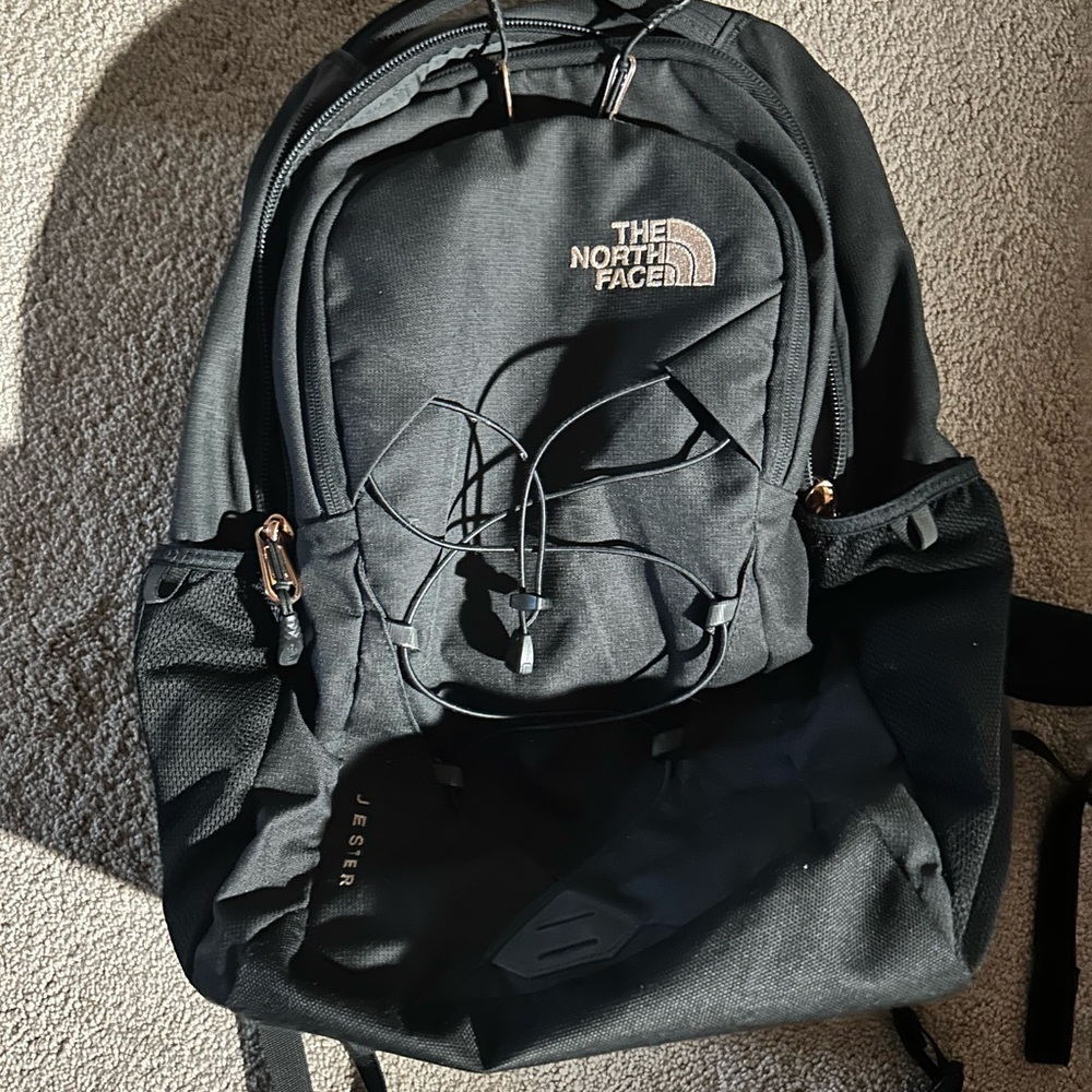 The North Face Black Backpack with Gold Accents